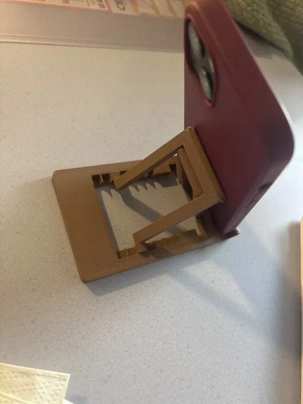 Soporte de móvil plegado, diseño simple y funcional